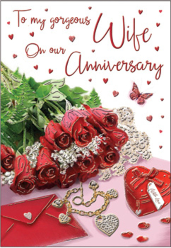A richly romantic anniversary tableau stretches across the card, composed with the same care a local Biggin Hill florist might give to a bespoke bouquet. Dominating the scene is a graceful cluster of red roses, their petals open and full, each bloom layered like soft satin. The deep crimson tones are intensified by the soft daylight, which brushes along the petal edges and reveals subtle shadows within the blossoms. Fresh greenery nestles around the roses, echoing the natural foliage seen on walks towards Aperfield or along the nearby country paths. To one side, a creamy envelope rests at a slight angle, its clean lines and smooth texture offering a quiet contrast to the organic curves of the flowers. Positioned thoughtfully near the envelope is a small heart-shaped keepsake box, polished to a gentle shine, accompanied by a glimmer of jewellery-perhaps a pendant or delicate chain-symbolising treasured memories and promises kept. Tiny hearts are scattered across the surface like confetti, some catching the light, others dissolving softly into the background. A single butterfly motif hovers close to the roses, suggesting transformation, renewal, and the lightness of shared happiness. The background remains muted, allowing the red, gold, and soft neutral tones to glow without distraction, like a table set for an anniversary supper at home. The entire composition feels warm and inviting, evoking the faint perfume of freshly cut roses, the rustle of card stock, and the quiet anticipation that comes before gifting an anniversary surprise carefully planned and lovingly delivered.