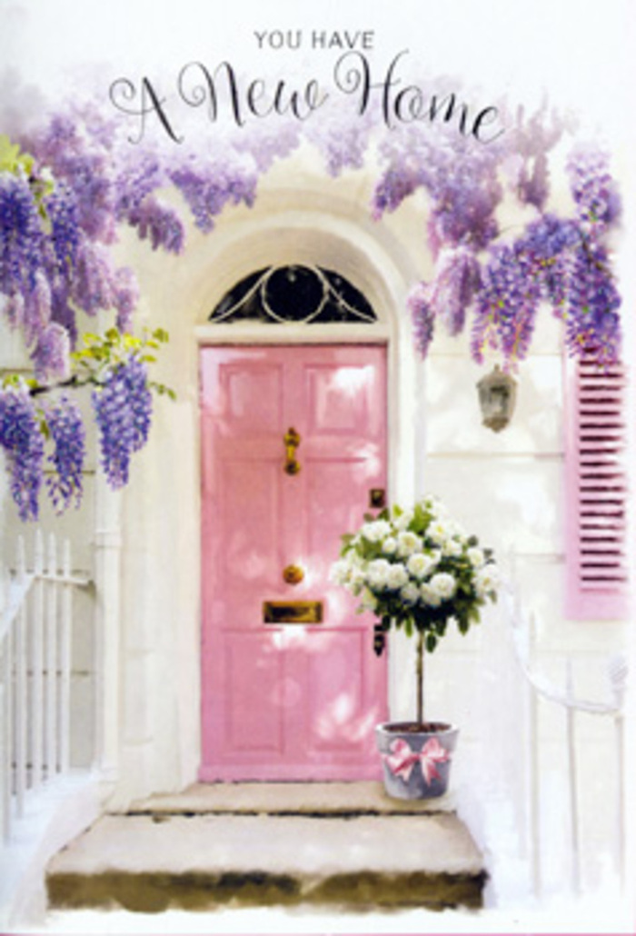 Approaching this serene Biggin Hill entrance, you sense the quiet joy of arrival long before you would reach the step. A soft pink front door, painted in a calm, rosy pastel, becomes the heart of the scene, centred beneath a romantic canopy of wisteria that spills in long, lavender streamers from above. The blossoms hang thickly, as if they have been slowly trained over the seasons by someone who loves watching spring unfold over the hills and gardens of Biggin Hill. Around the doorway, whitewashed walls carry hints of texture and history, their sun-warmed surface subtly echoing the chalky tones of nearby country cottages. A single painted shutter mirrors the blush and white palette, catching natural light so that it flickers gently across the façade like dapples through leaves. At the base of the door, resting confidently on the step, stands a chic, tin-style bucket in a soft grey, filled to overflowing with velvety white and cream roses. Each rose feels full-hearted and freshly opened, their petals arranged with expert care among sprigs of soft, green foliage that spill and curl in just the right places. A satin pink ribbon encircles the bucket, its bow slightly off-centre for a relaxed, hand-tied finish that hints at a florist's personal touch rather than something mass-produced. The imagined fragrance is a soothing blend of roses and wisteria drifting on the breeze that passes through Biggin Hill's leafy lanes. This scene captures the tender emotions of moving into a new home: anticipation, vulnerability, and hope, distilled into flowers that turn an ordinary doorstep into a symbolic threshold of welcome, belonging, and the promise of many happy returns through that pink door.